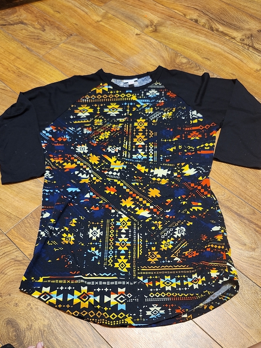 LuLaRoe Black Aztec Print Top with Yellow & Light Blue Motifs